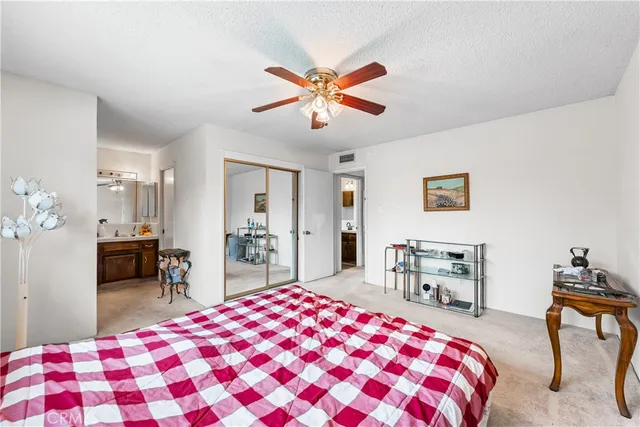 a bedroom with a bed and a dresser in it