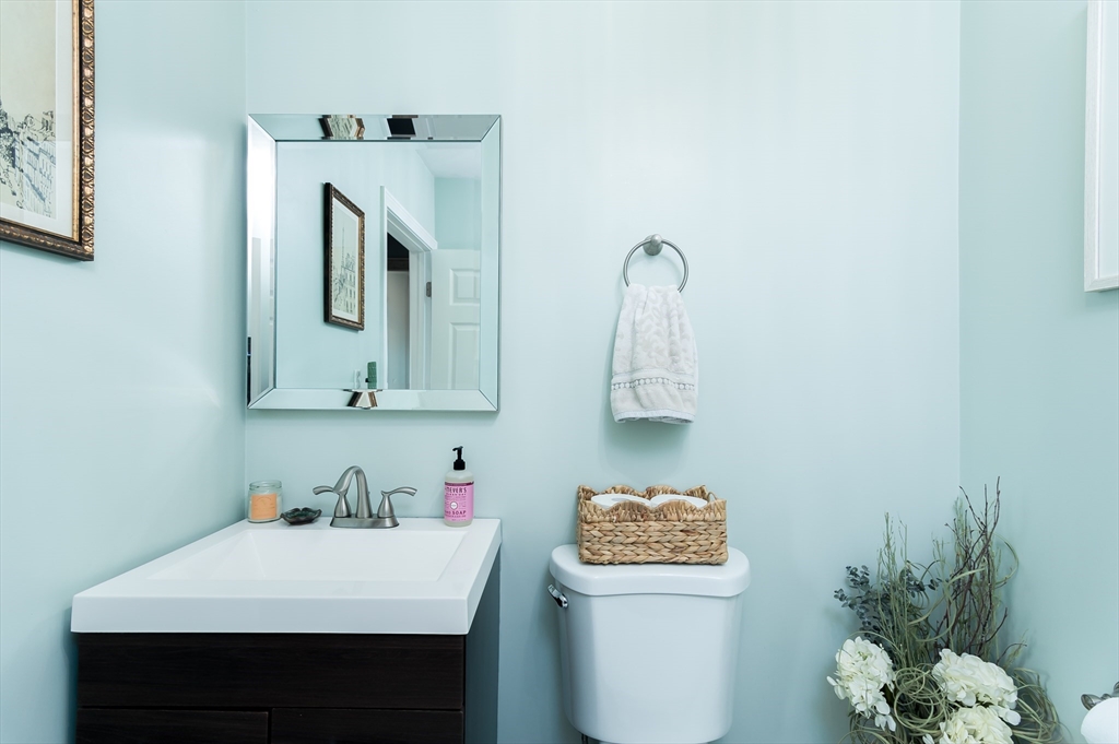 162 King Philip Road Worcester, MA 01606 - Photo 13 of 26 a bathroom with a sink a mirror and a toilet