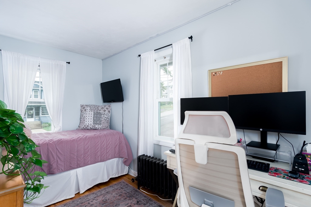 162 King Philip Road Worcester, MA 01606 - Photo 18 of 26 a bedroom with a bed and flat screen tv
