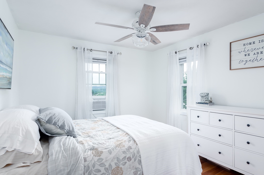162 King Philip Road Worcester, MA 01606 - Photo 21 of 26 a bedroom with a large bed and a window