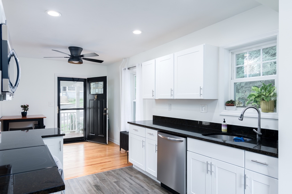 162 King Philip Road Worcester, MA 01606 - Photo 3 of 26 a kitchen with granite countertop a sink stainless steel appliances and cabinets
