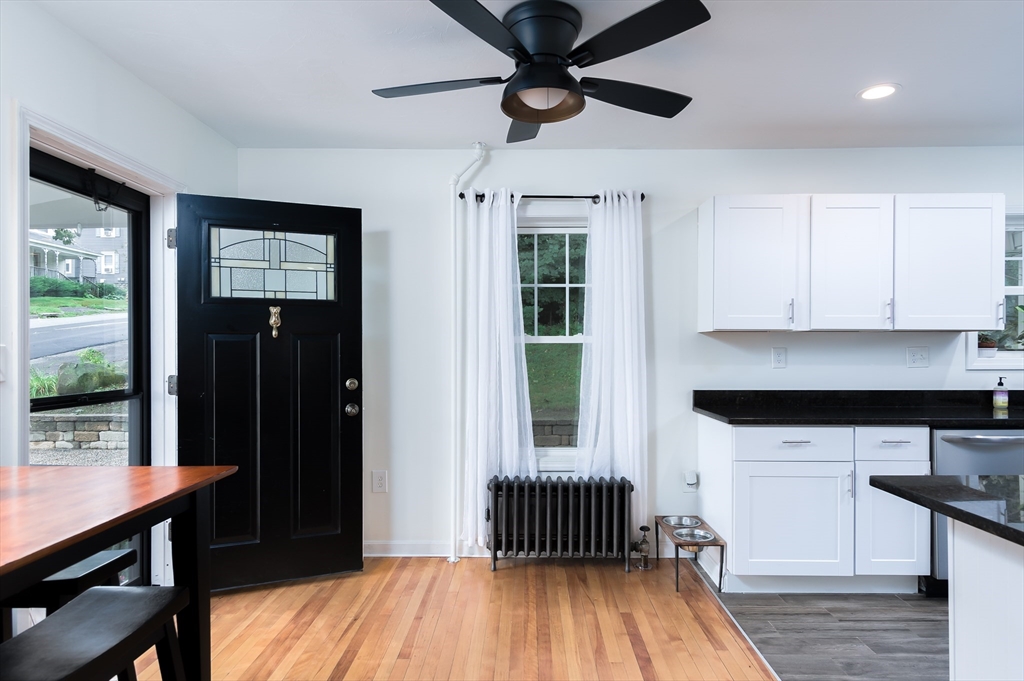 162 King Philip Road Worcester, MA 01606 - Photo 8 of 26 a kitchen with stainless steel appliances granite countertop a refrigerator a sink dishwasher a stove and white countertops with wooden floor