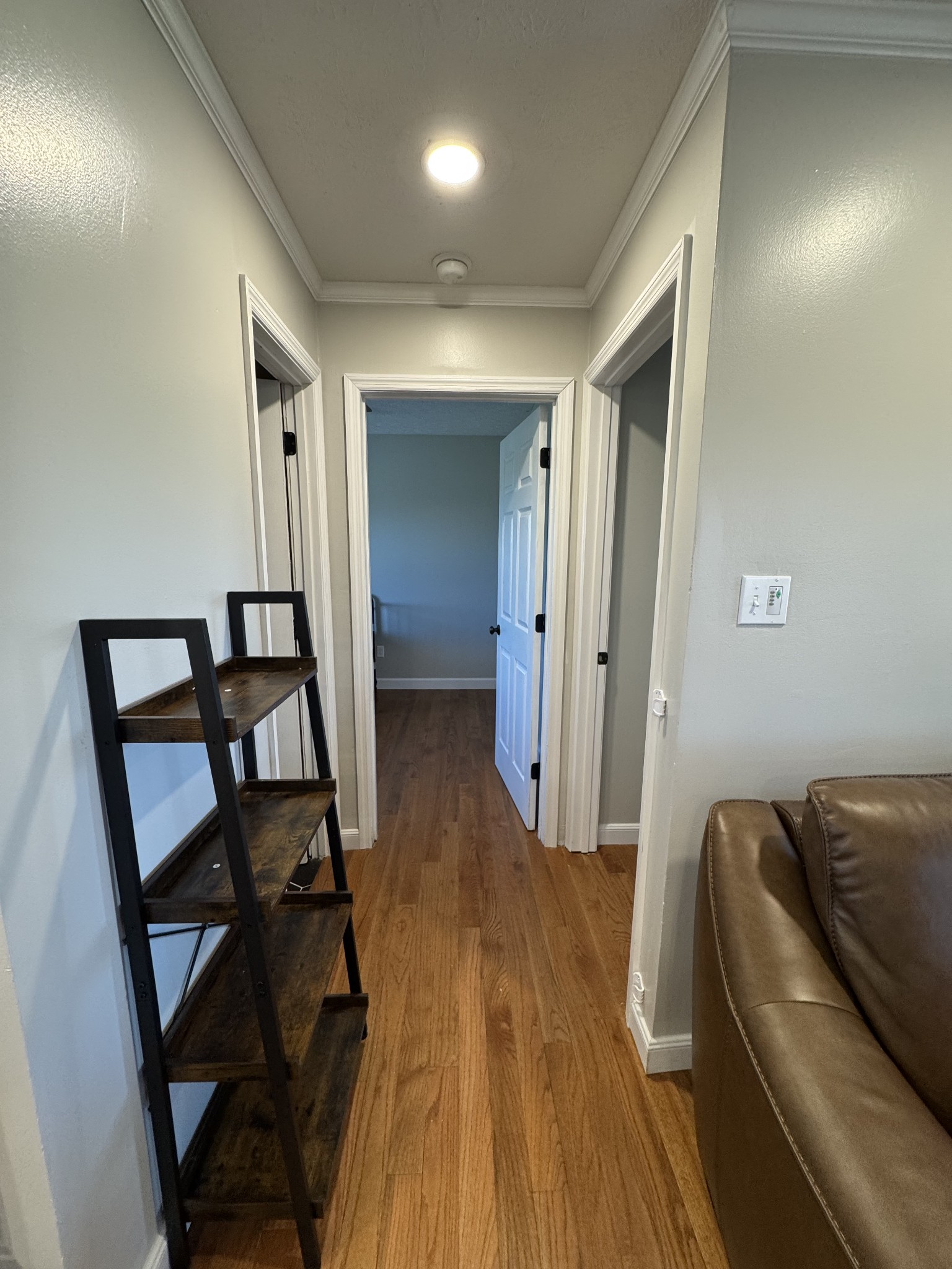 800 Pea Ridge-Sharon Grove Road Elkton, KY 42220 - Photo 19 of 43 a view of a hallway to a livingroom with furniture wooden floor and windows
