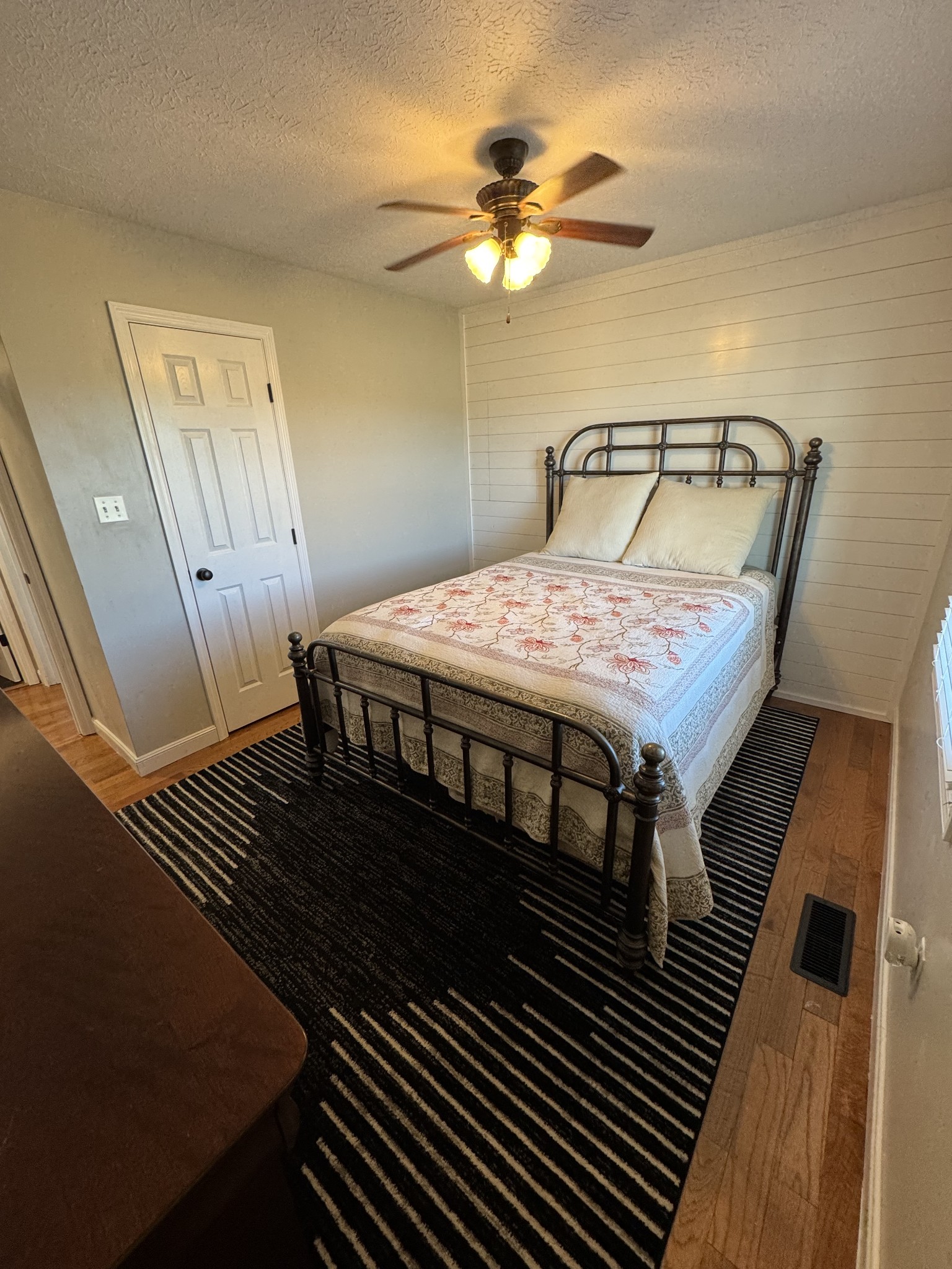 800 Pea Ridge-Sharon Grove Road Elkton, KY 42220 - Photo 22 of 43 a bedroom with a bed and a chandelier