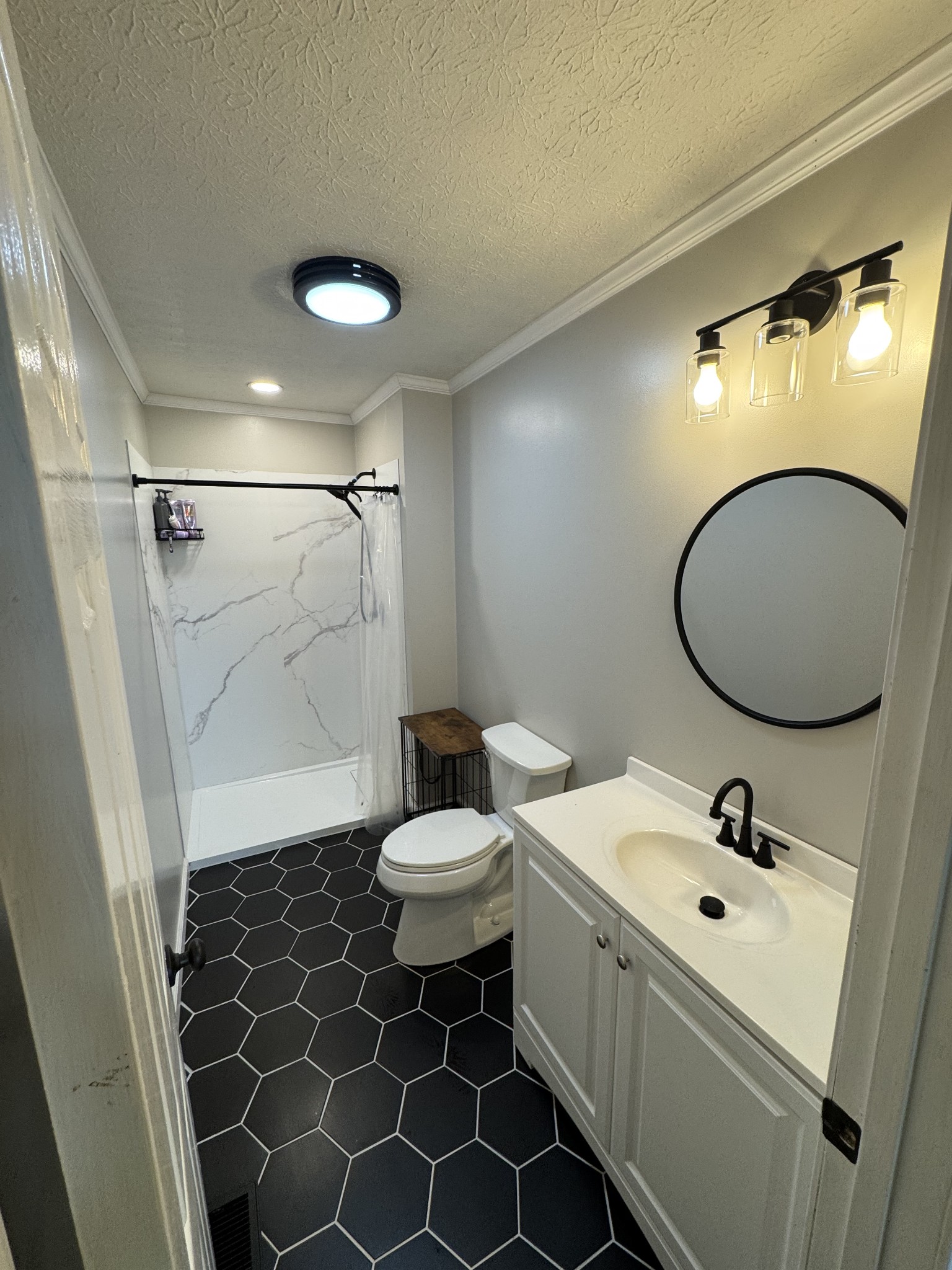 800 Pea Ridge-Sharon Grove Road Elkton, KY 42220 - Photo 31 of 43 a bathroom with a sink mirror vanity and toilet