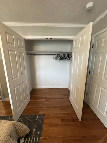 a view of wooden floor and staircase in a room