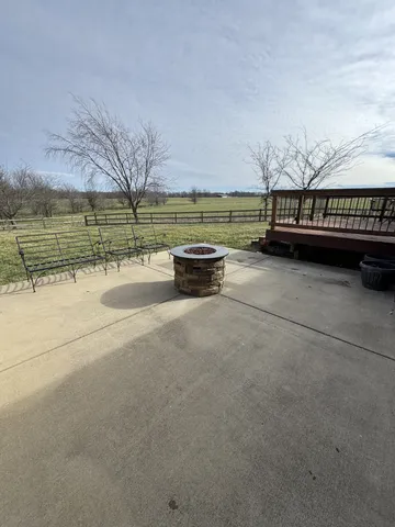 a view of swimming pool with outdoor seating and city view