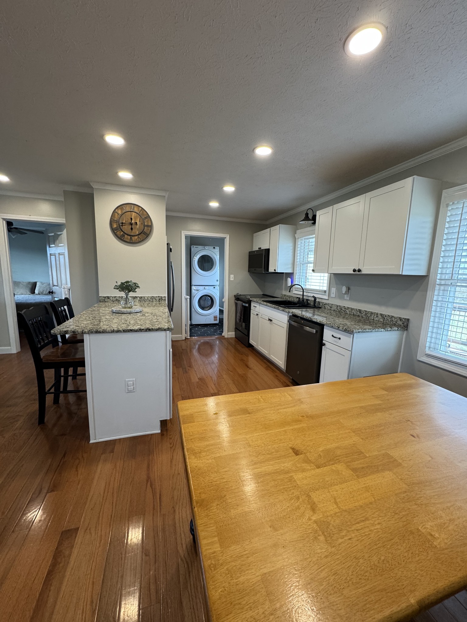 800 Pea Ridge-Sharon Grove Road Elkton, KY 42220 - Photo 7 of 43 a large kitchen with a center island and wooden floor