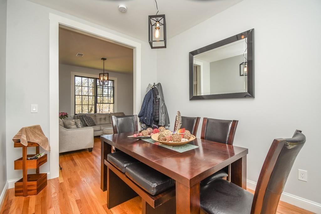 6 Edgehill Road Billerica, MA 01862 - Photo 11 of 24 a view of a dining room with furniture and wooden floor