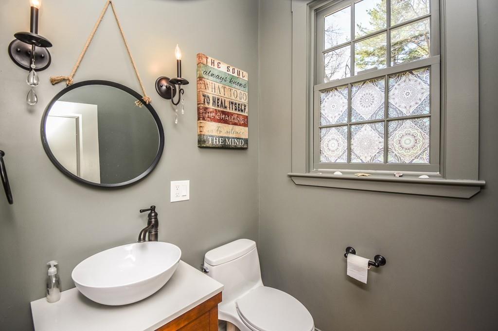 6 Edgehill Road Billerica, MA 01862 - Photo 12 of 24 a bathroom with a toilet a sink and mirror