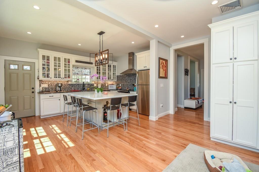 6 Edgehill Road Billerica, MA 01862 - Photo 14 of 24 a kitchen with stainless steel appliances kitchen island granite countertop a refrigerator and a sink