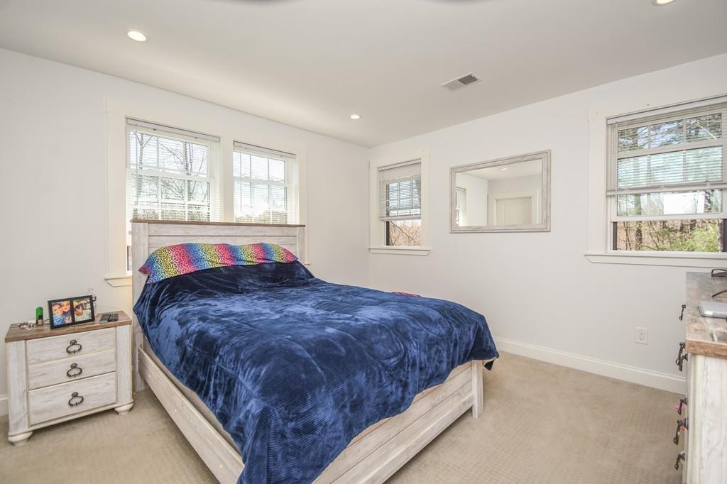6 Edgehill Road Billerica, MA 01862 - Photo 17 of 24 a bedroom with a bed and a window