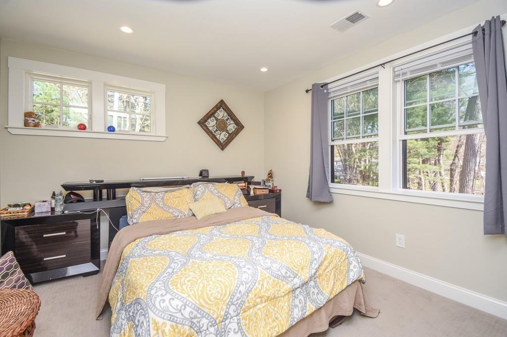 6 Edgehill Road Billerica, MA 01862 - Photo 20 of 24 a bed sitting in a bedroom next to a window