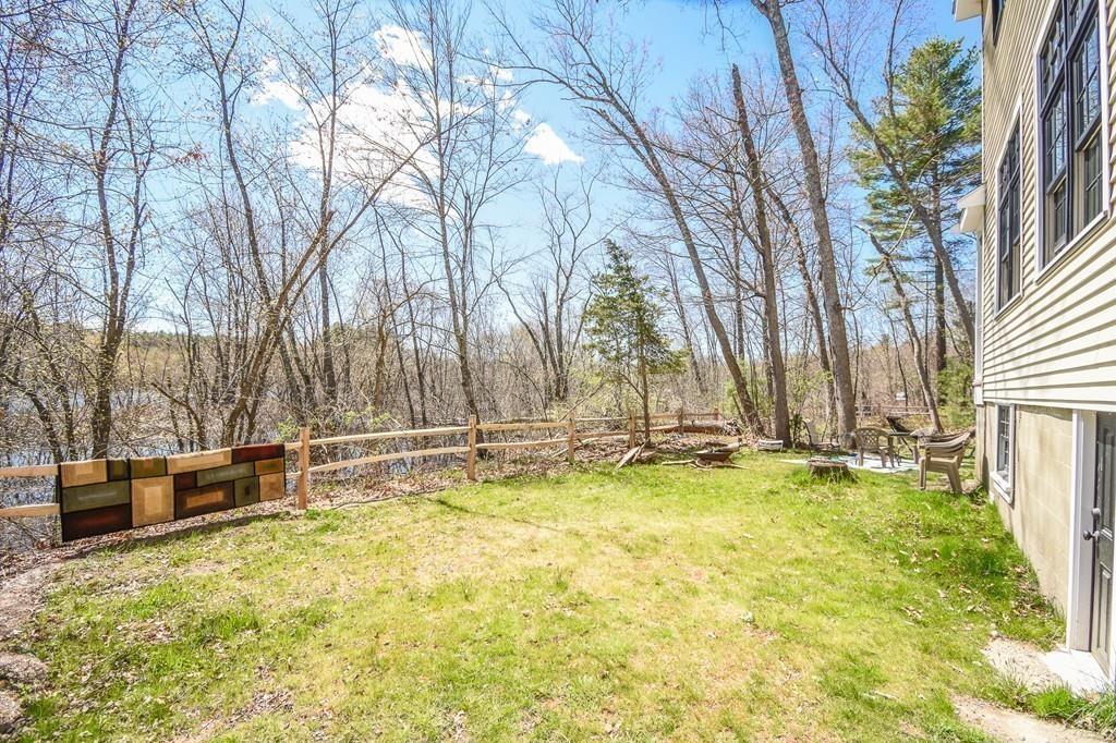 6 Edgehill Road Billerica, MA 01862 - Photo 22 of 24 a view of a swimming pool with some potted plants and large tree