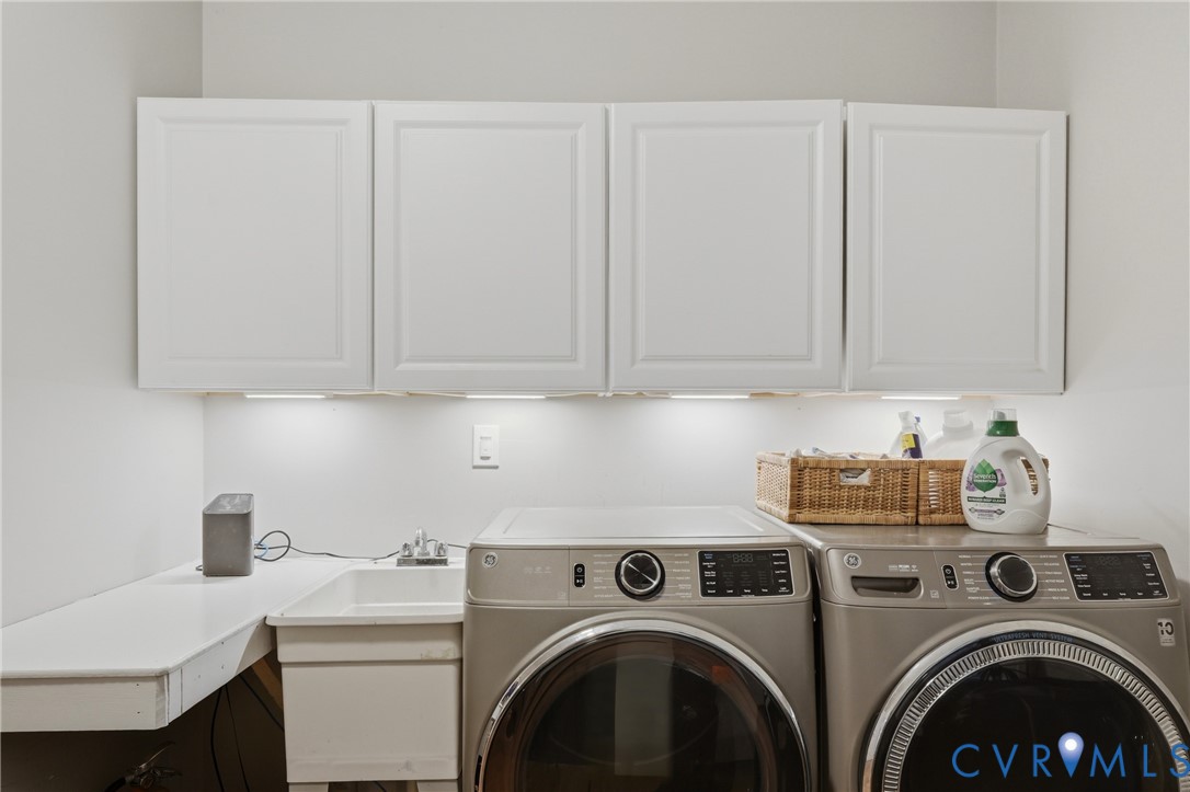 1755 Dispatch Road Quinton, VA 23141 - Photo 21 of 35 White cabinetry with under-cabinet lighting, utili