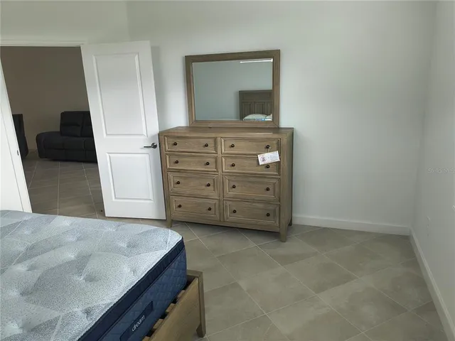 a view of bedroom with furniture