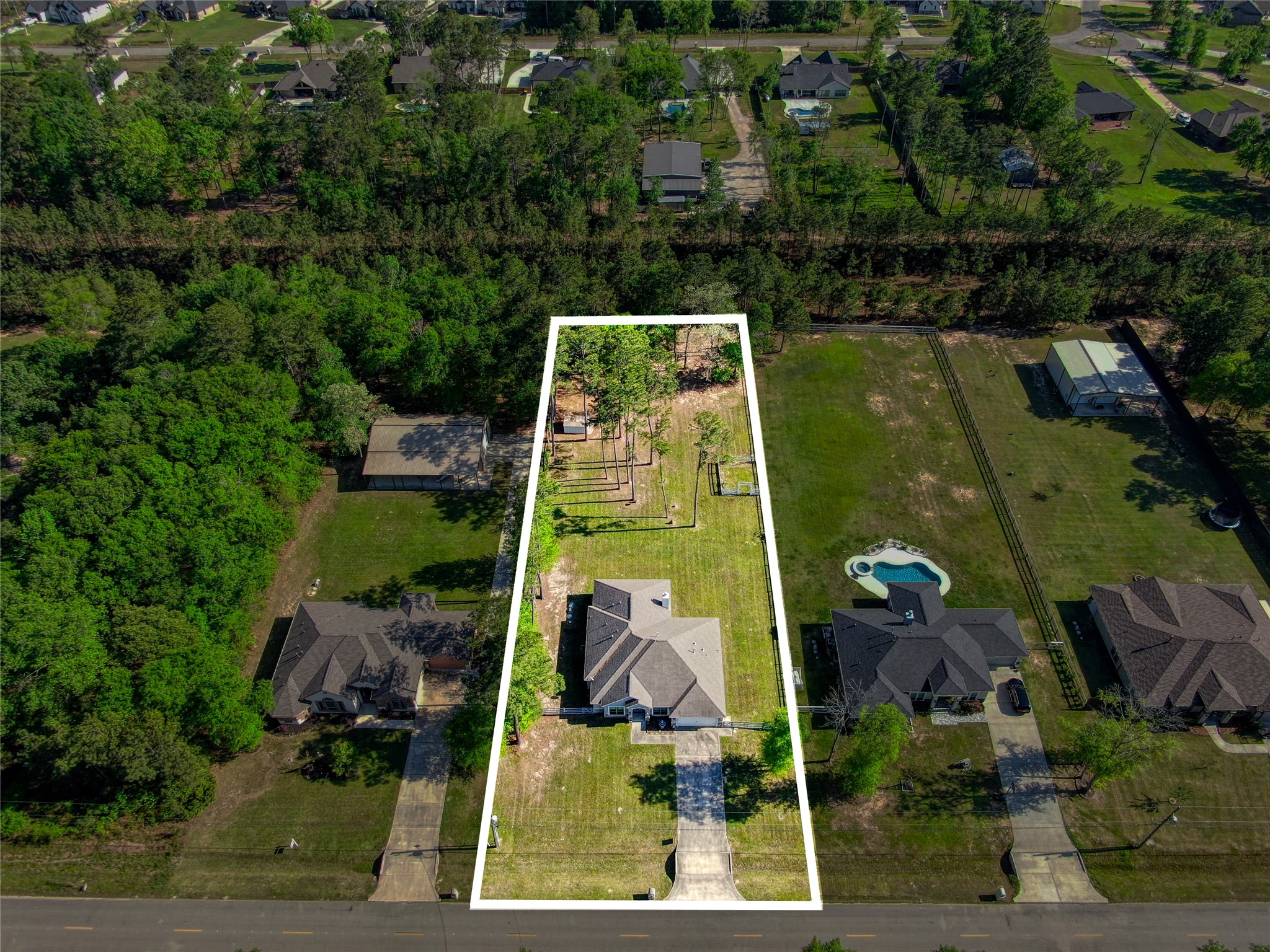 27684 Rio Blanco Drive Splendora, TX 77372 - Photo 30 of 31 an aerial view of a house with a yard