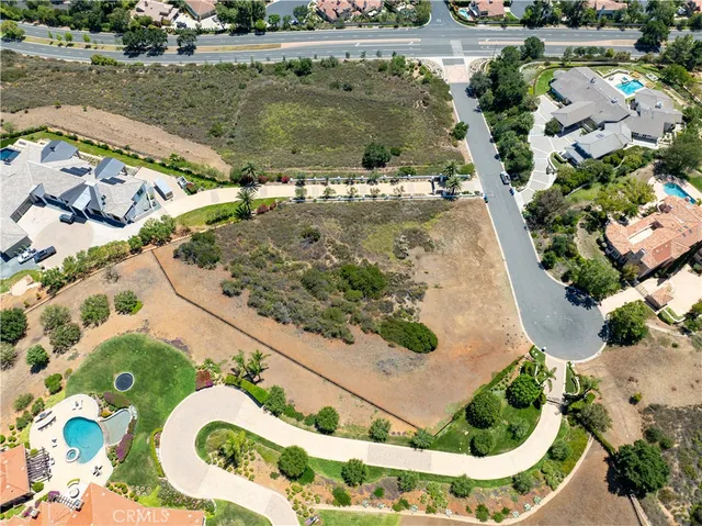 a view of a swimming pool with a yard