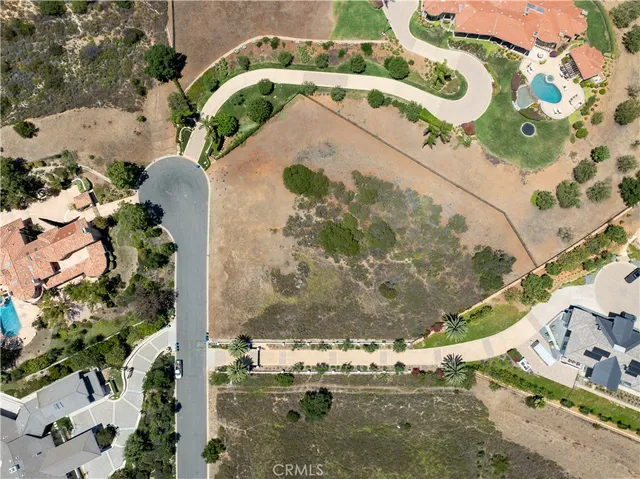 a view of a swimming pool with a yard