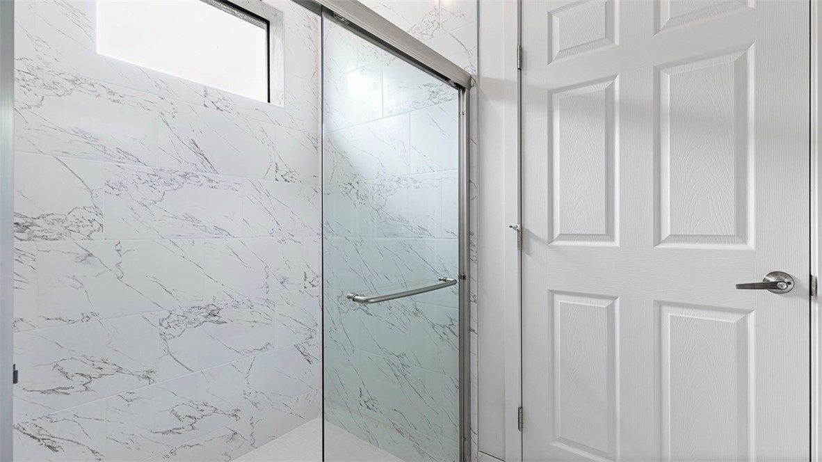 7008 Eden Road Fort Pierce, FL 34951 - Photo 24 of 29 a bathroom with a shower