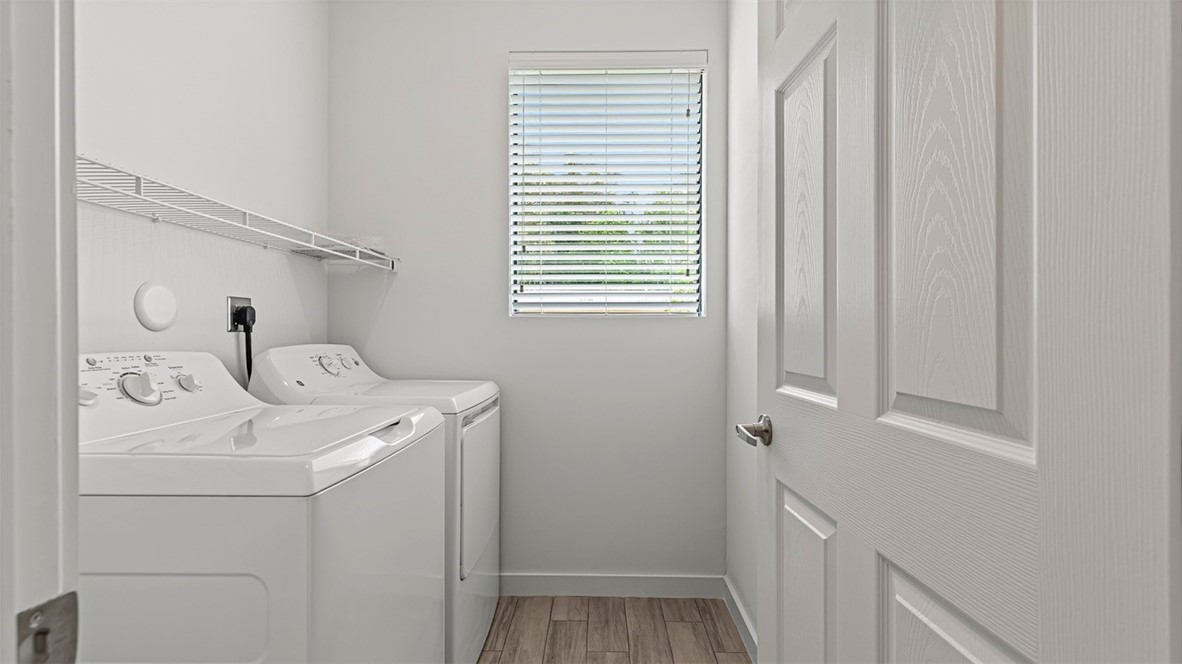 7008 Eden Road Fort Pierce, FL 34951 - Photo 26 of 29 a utility room with dryer and washer