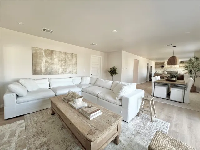 a bathroom with a glass shower door and a shower
