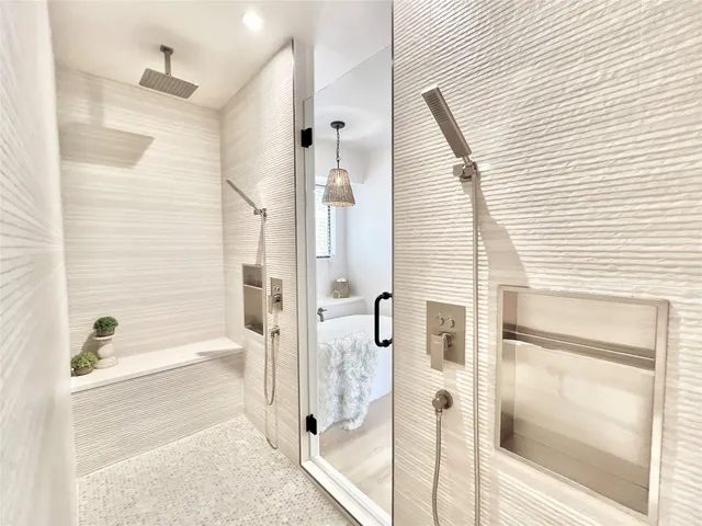 a bedroom with a bed and a mirror