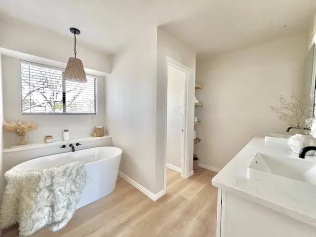 a bedroom with bed and window