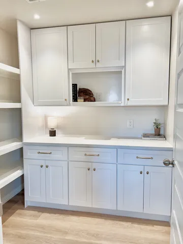 a view of a house with swimming pool and sitting area