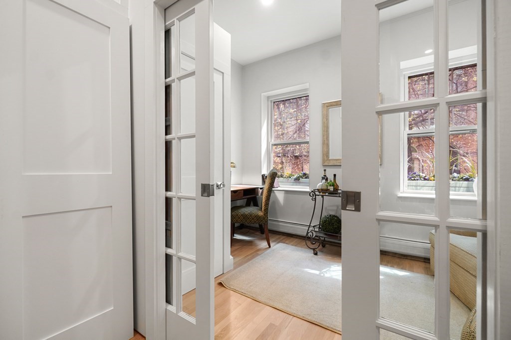 43 Anderson Street, Unit 1 Boston, MA 02114 - Photo 11 of 36 a view of a livingroom with workspace and a window
