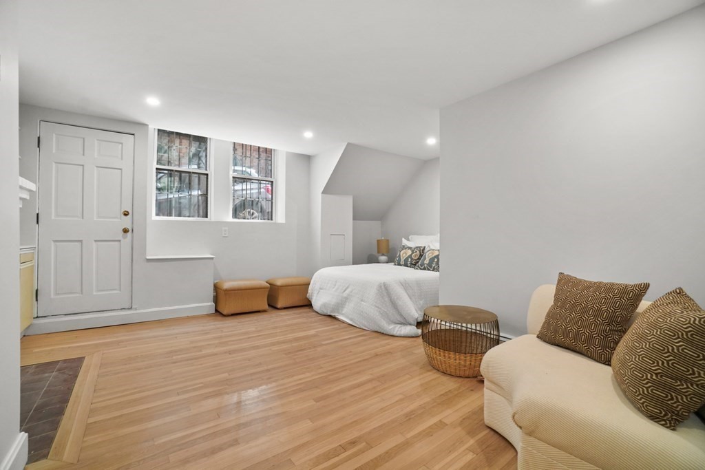 43 Anderson Street, Unit 1 Boston, MA 02114 - Photo 19 of 36 a bedroom with a bed and wooden floor