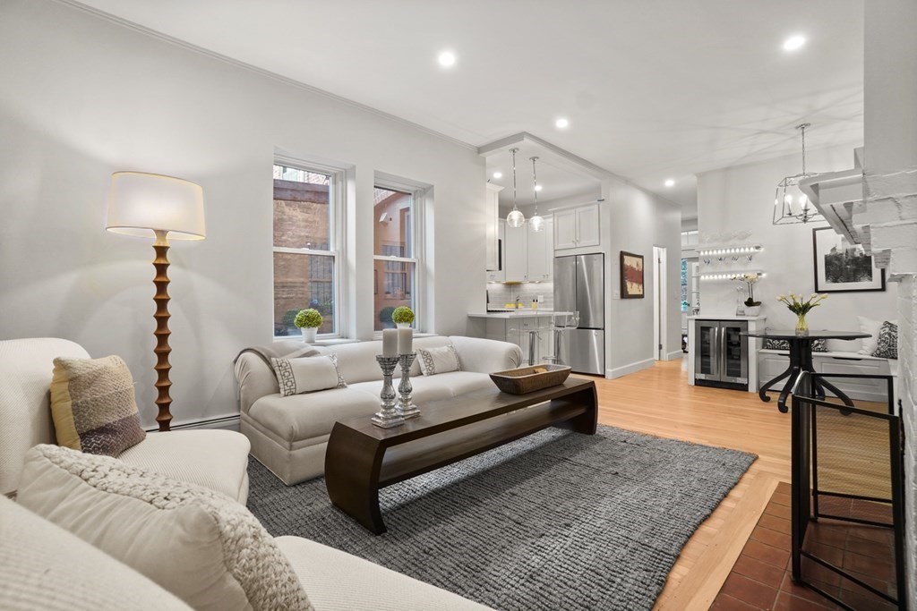 43 Anderson Street, Unit 1 Boston, MA 02114 - Photo 2 of 36 a living room with furniture and a rug