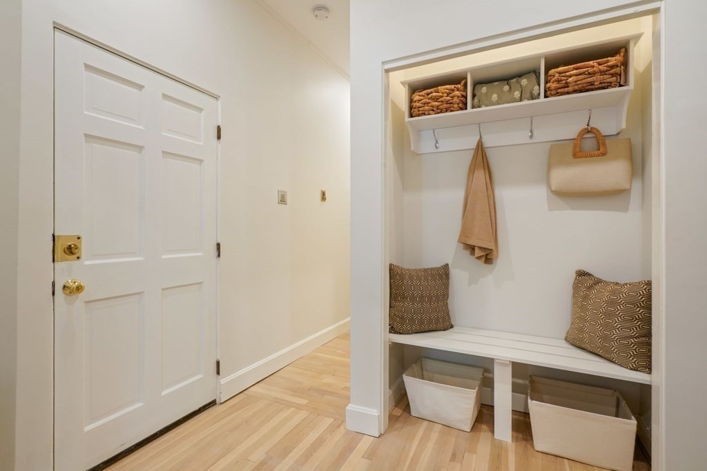 43 Anderson Street, Unit 1 Boston, MA 02114 - Photo 22 of 36 a white cabinet and a rug