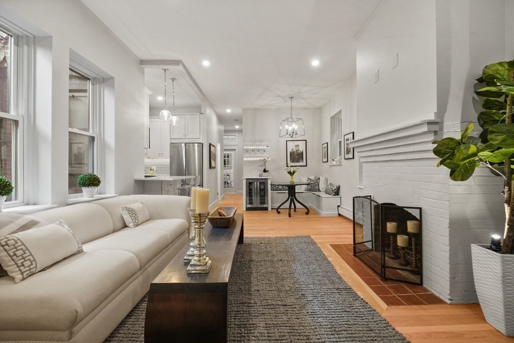 43 Anderson Street, Unit 1 Boston, MA 02114 - Photo 3 of 36 a living room with furniture and a fireplace