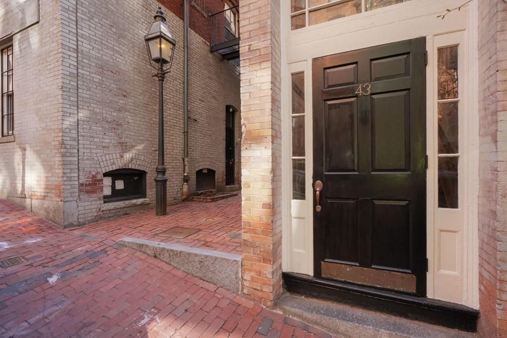 43 Anderson Street, Unit 1 Boston, MA 02114 - Photo 34 of 36 a view of an entrance to house with backyard