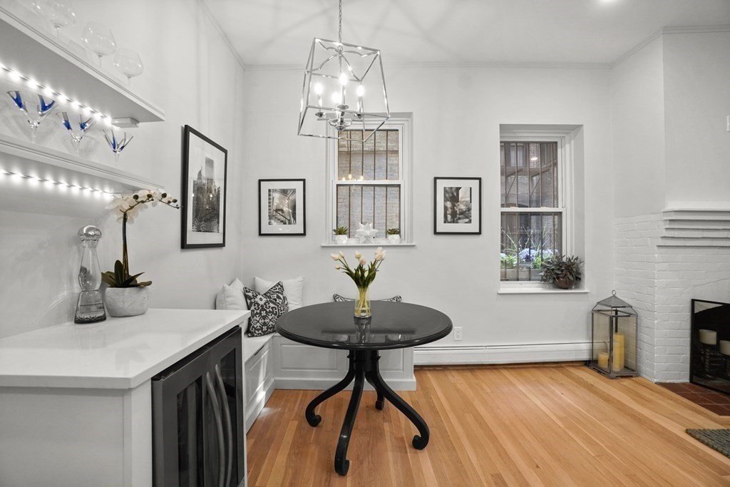 43 Anderson Street, Unit 1 Boston, MA 02114 - Photo 6 of 36 a kitchen with granite countertop a sink cabinets and dining table