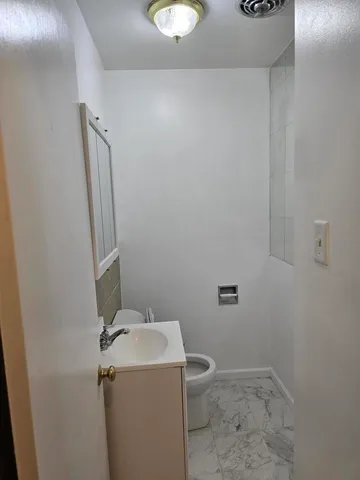a bathroom with a sink and toilet