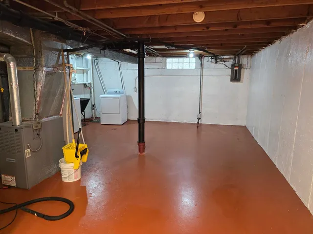 a view of a room with wooden floor and windows