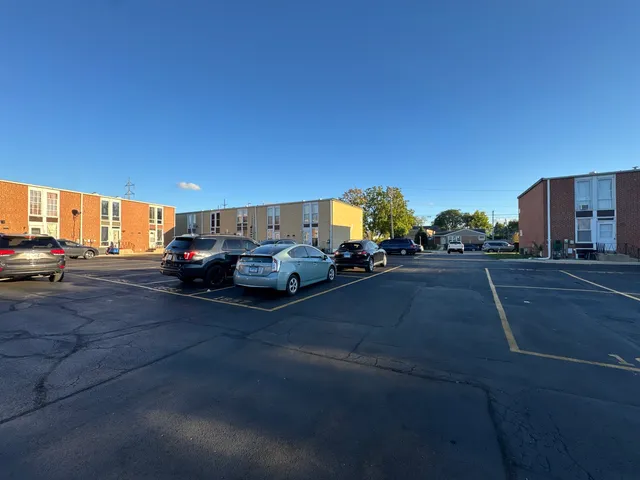 a view of a car park side of a road