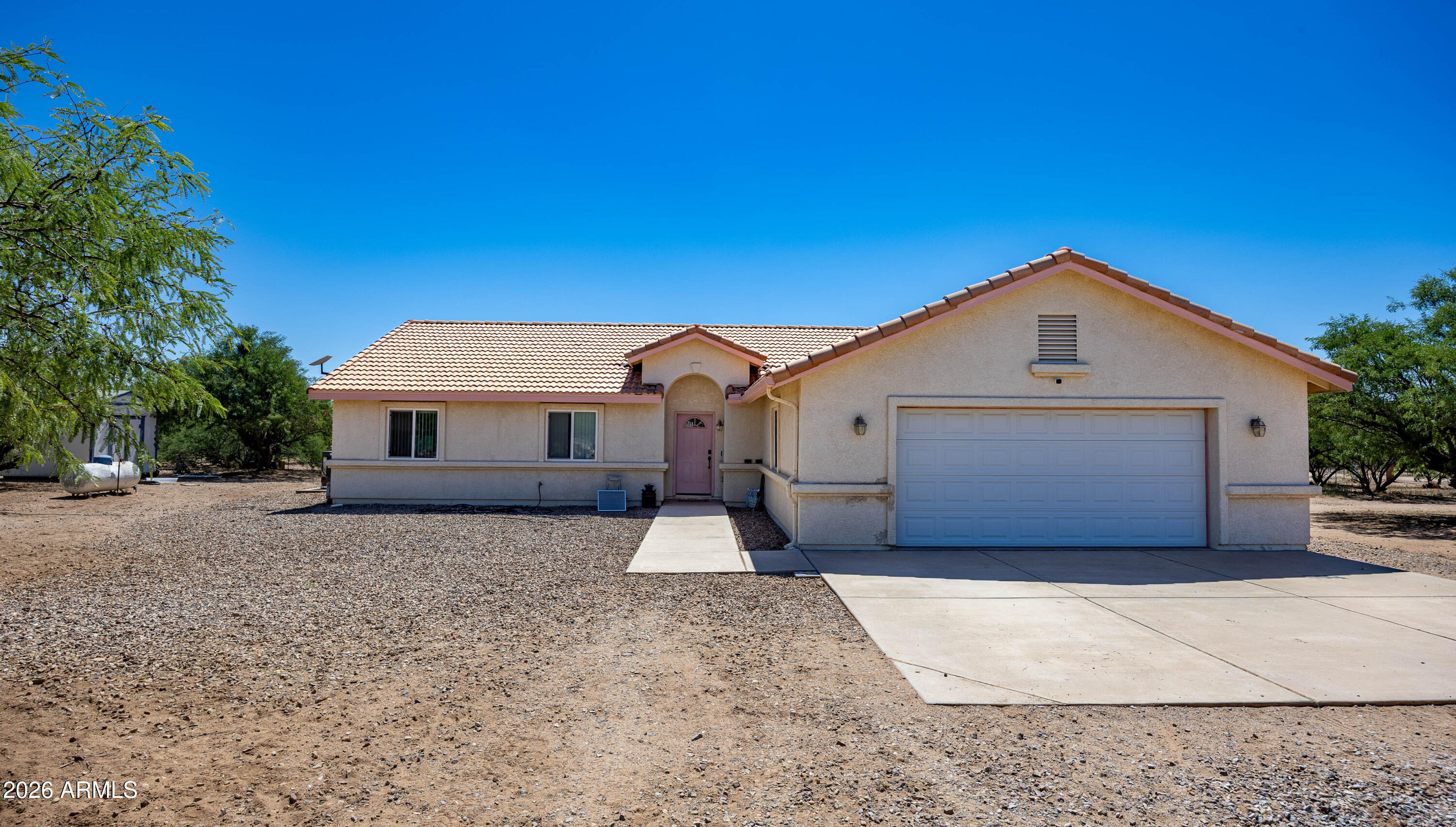 4575 South Kino Road Sierra Vista, AZ 85650 - Photo 1 of 25 a front view of a house with a yard and garage