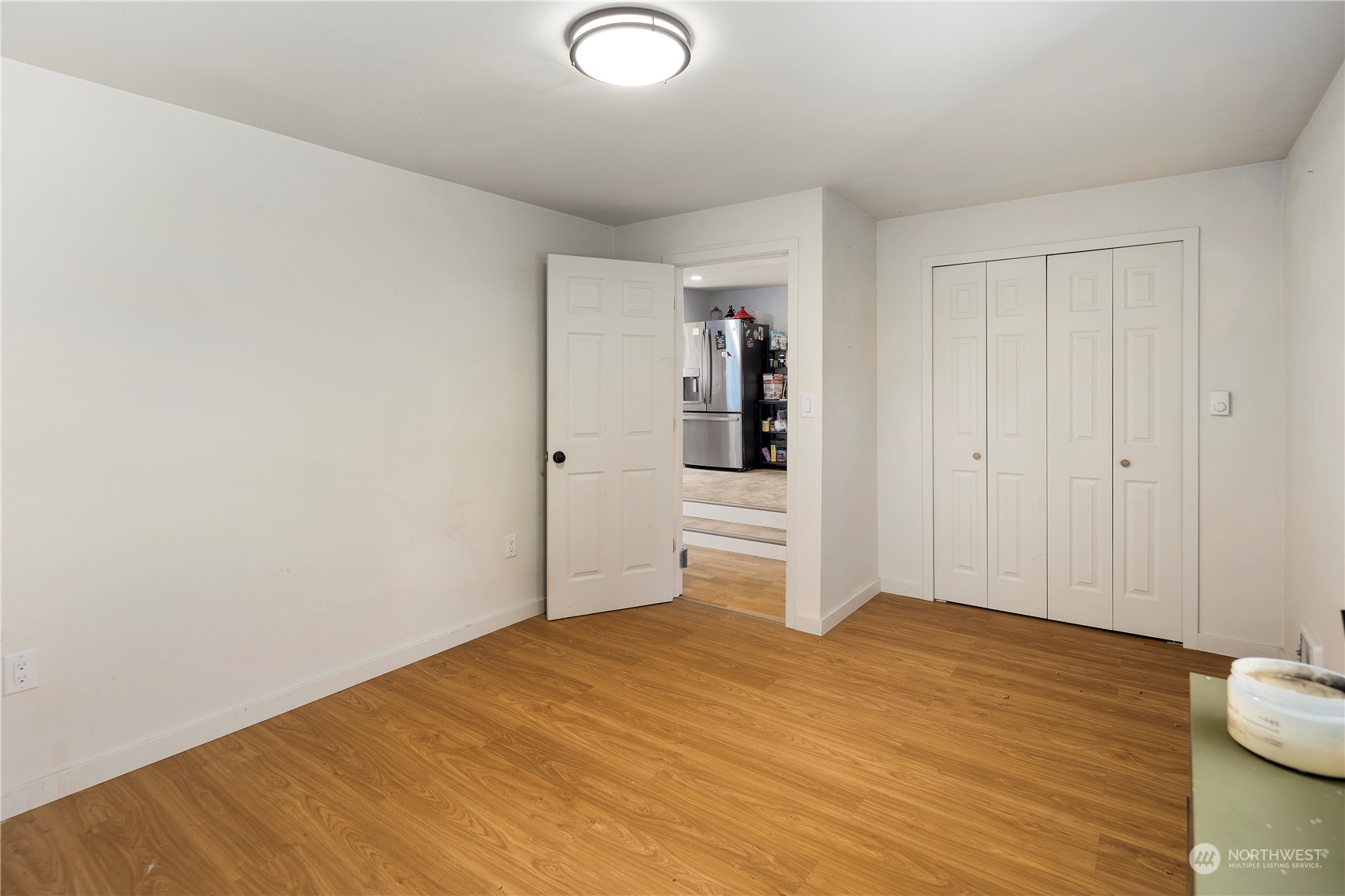 7728 South 128th Street Seattle, WA 98178 - Photo 13 of 31 a view of empty room with wooden floor