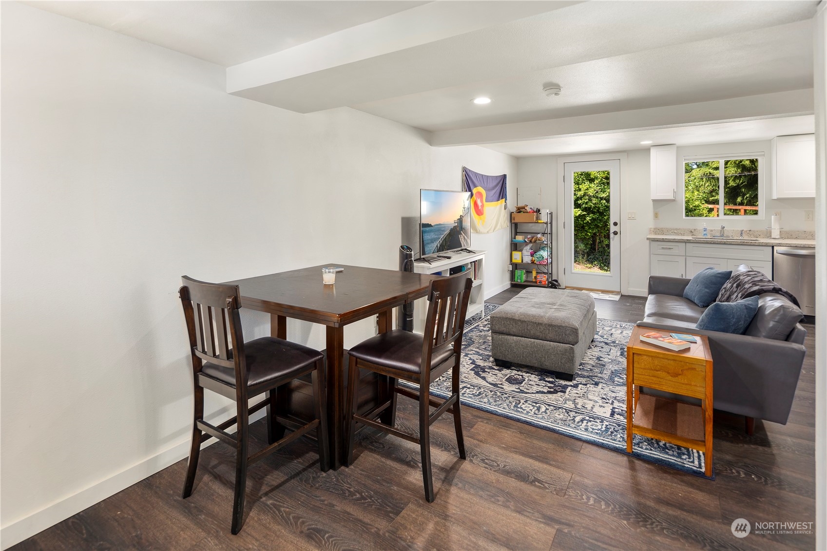 7728 South 128th Street Seattle, WA 98178 - Photo 19 of 31 a living room with furniture and a wooden floor