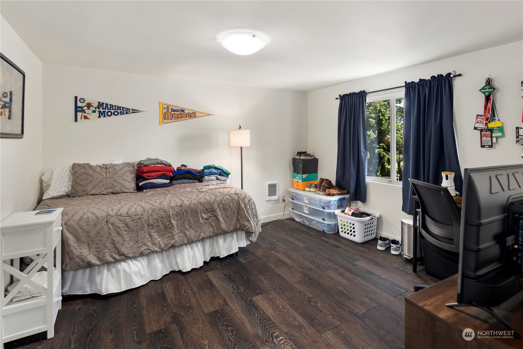 7728 South 128th Street Seattle, WA 98178 - Photo 23 of 31 a bedroom with a bed and wooden floor