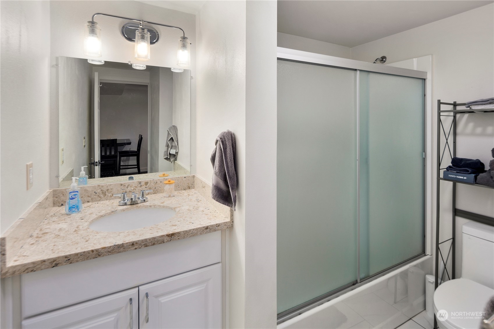 7728 South 128th Street Seattle, WA 98178 - Photo 24 of 31 a bathroom with a granite countertop sink a toilet and shower
