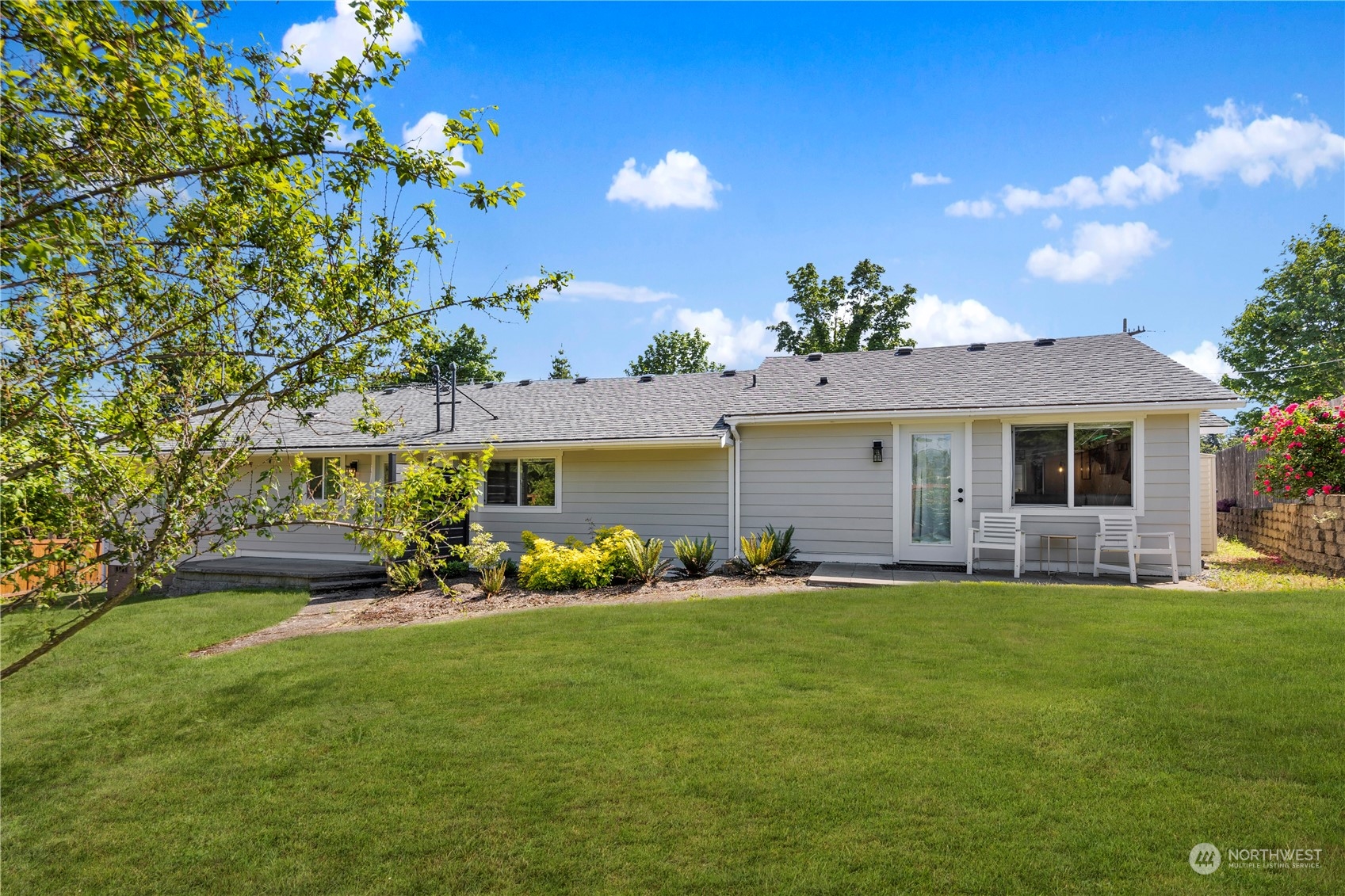 7728 South 128th Street Seattle, WA 98178 - Photo 25 of 31 a front view of a house with a garden and yard