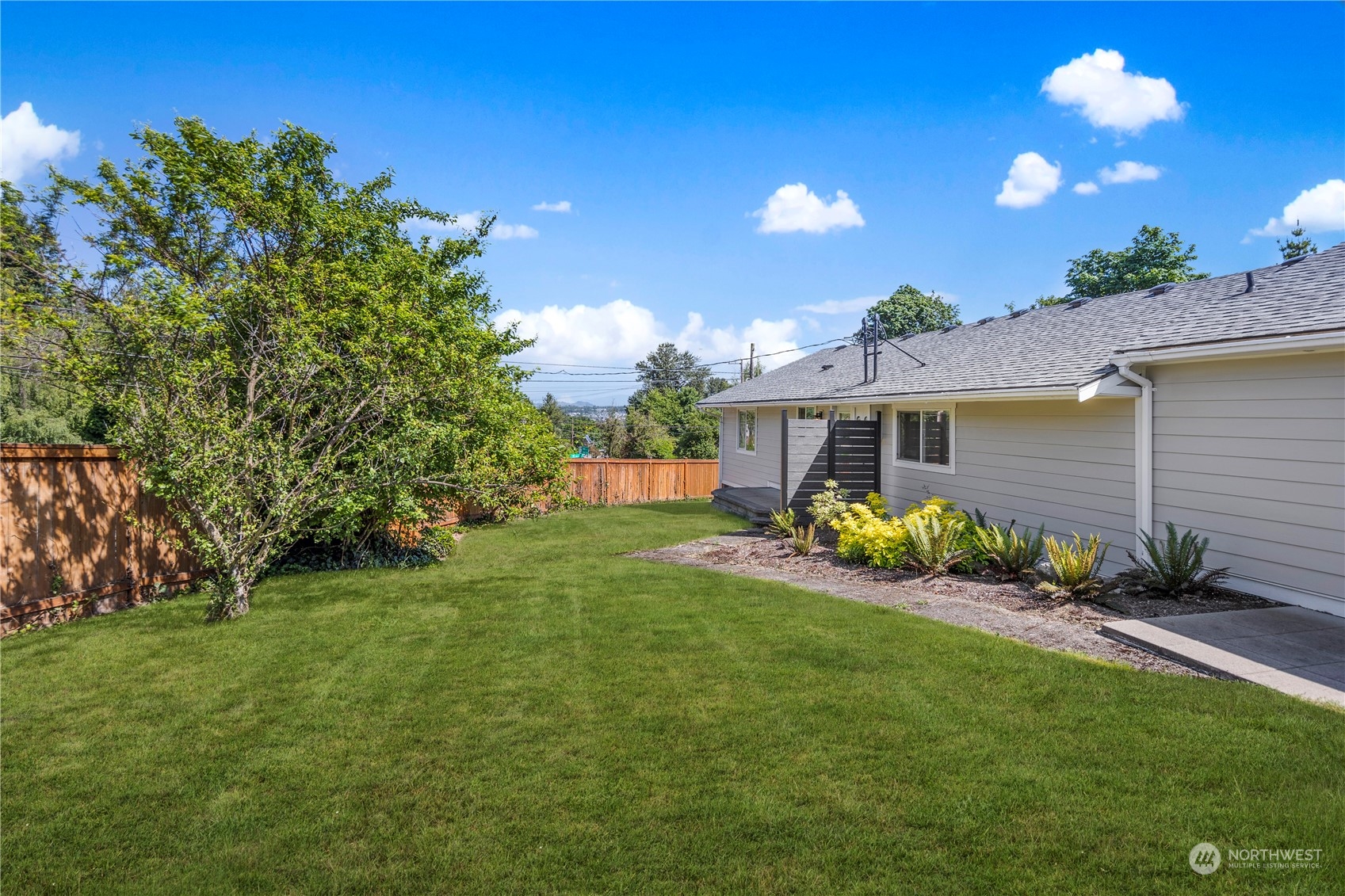 7728 South 128th Street Seattle, WA 98178 - Photo 28 of 31 a view of a house with backyard and sitting area