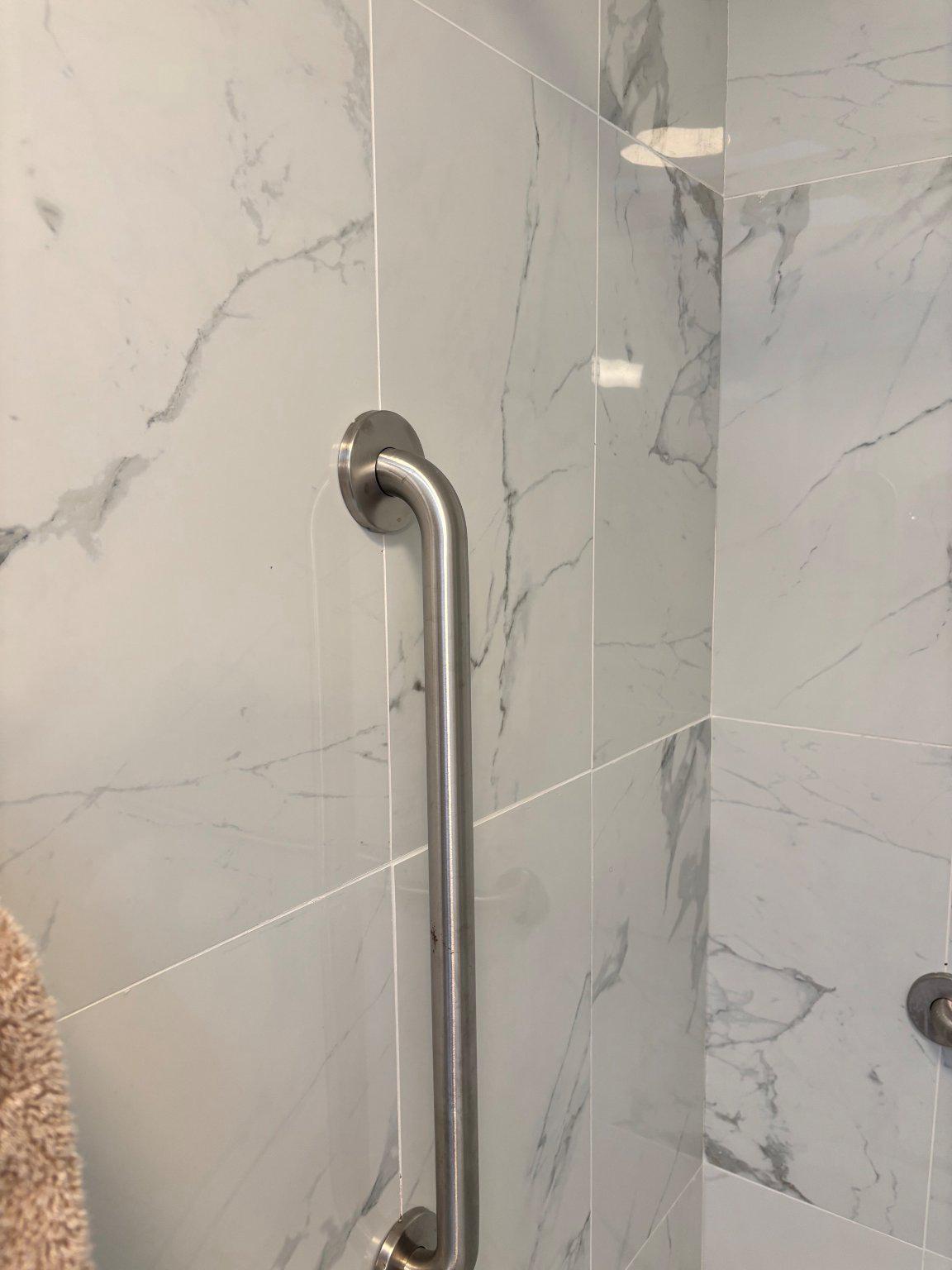 608 6th Place Southwest Washington, DC 20024 - Photo 46 of 65 The Marble shower even has a safety rail.