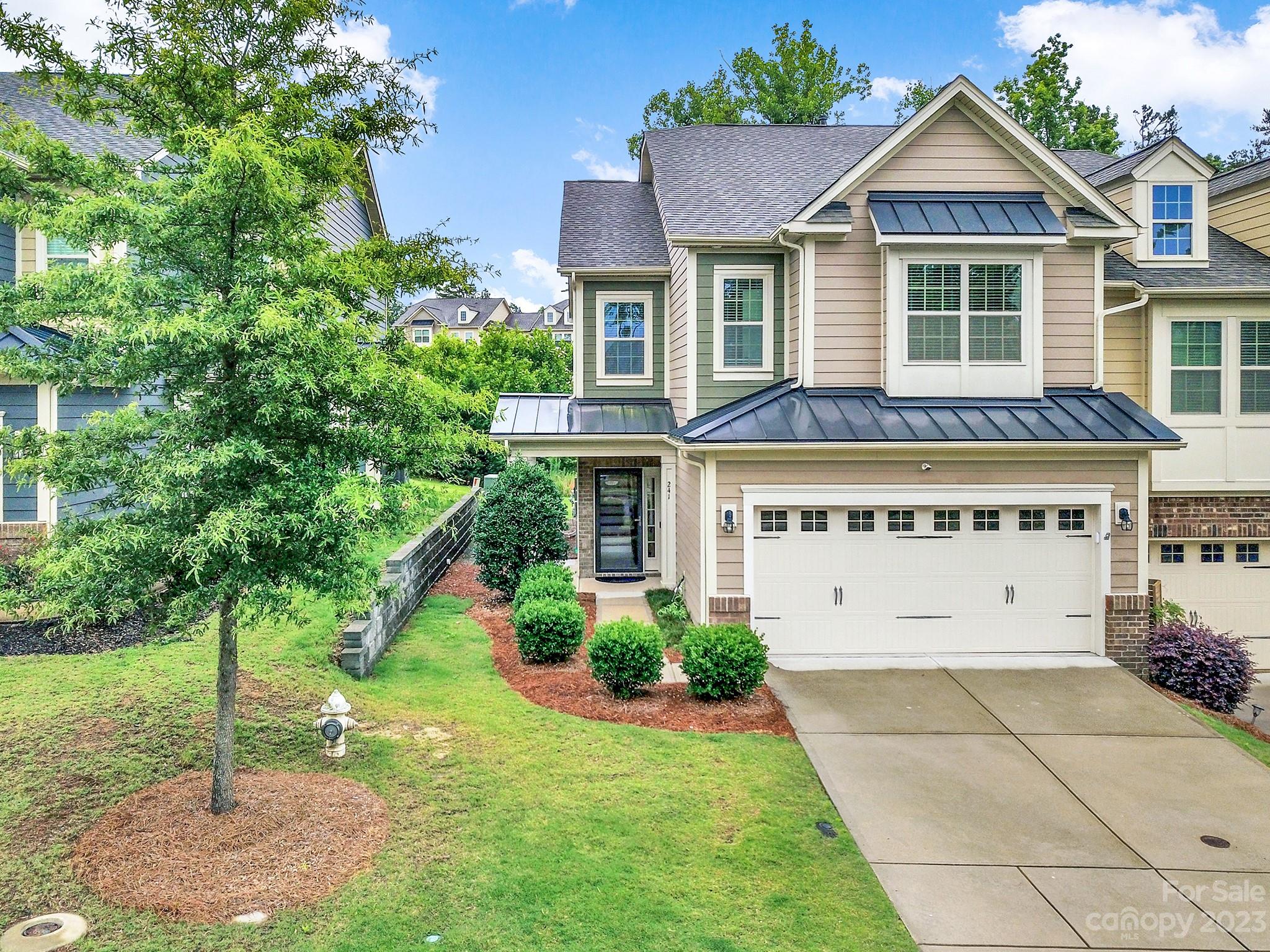 241 Butterfly Place Tega Cay, SC 29708 - Photo 2 of 42 a view of a house with a yard