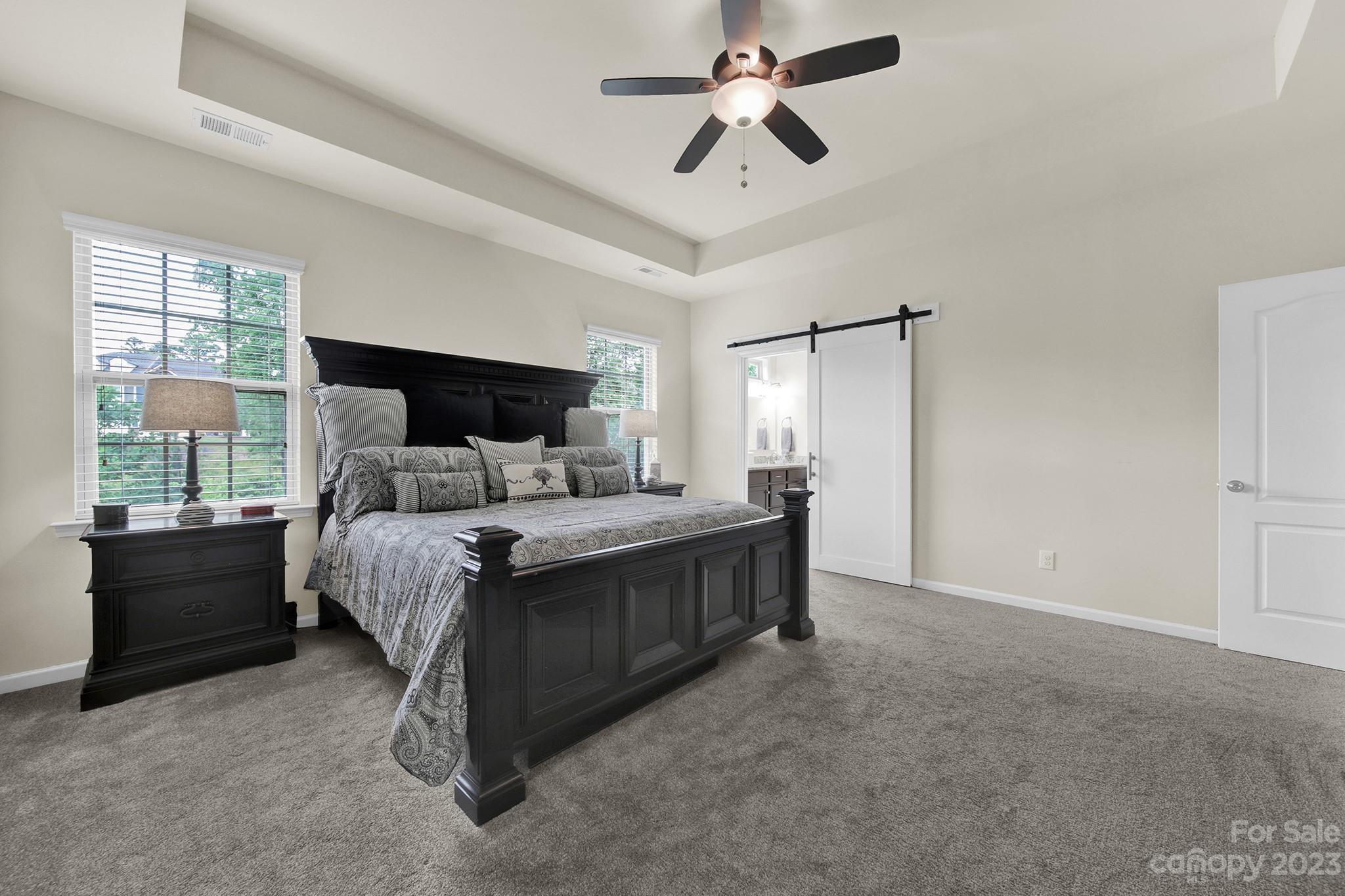 241 Butterfly Place Tega Cay, SC 29708 - Photo 26 of 42 a bedroom with a bed dresser and a window