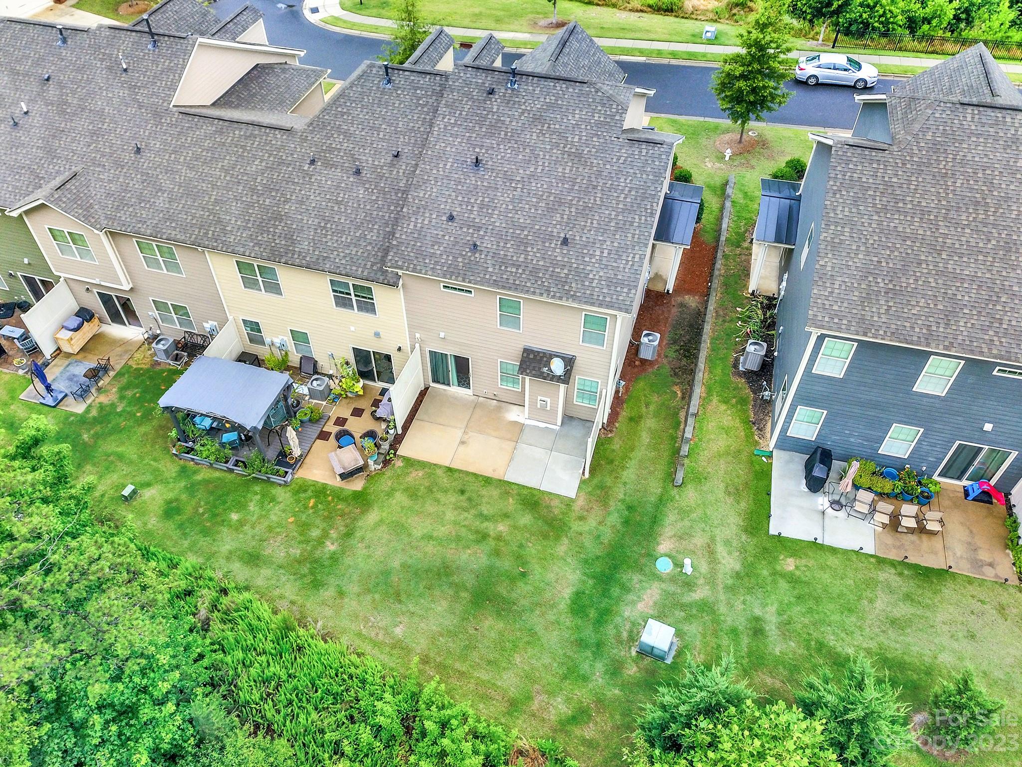 241 Butterfly Place Tega Cay, SC 29708 - Photo 34 of 42 an aerial view of a house with a yard